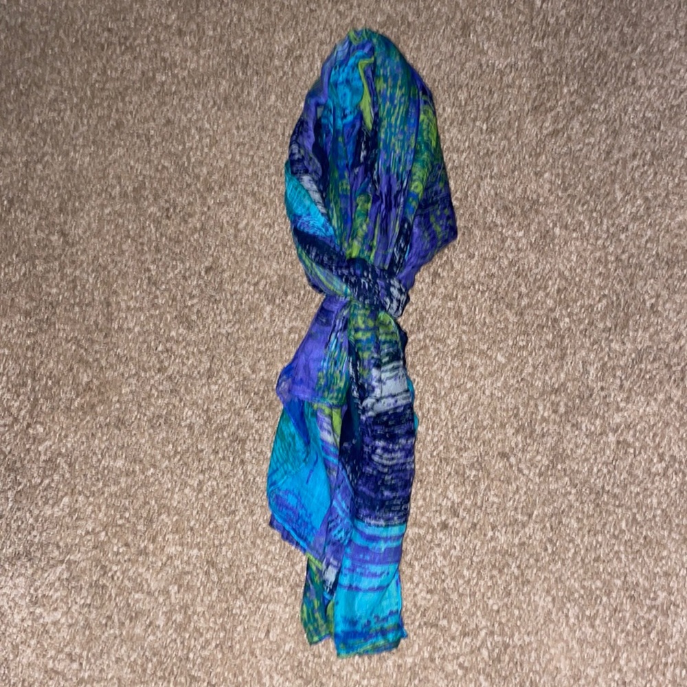 Blue, green and white patterned scarf.